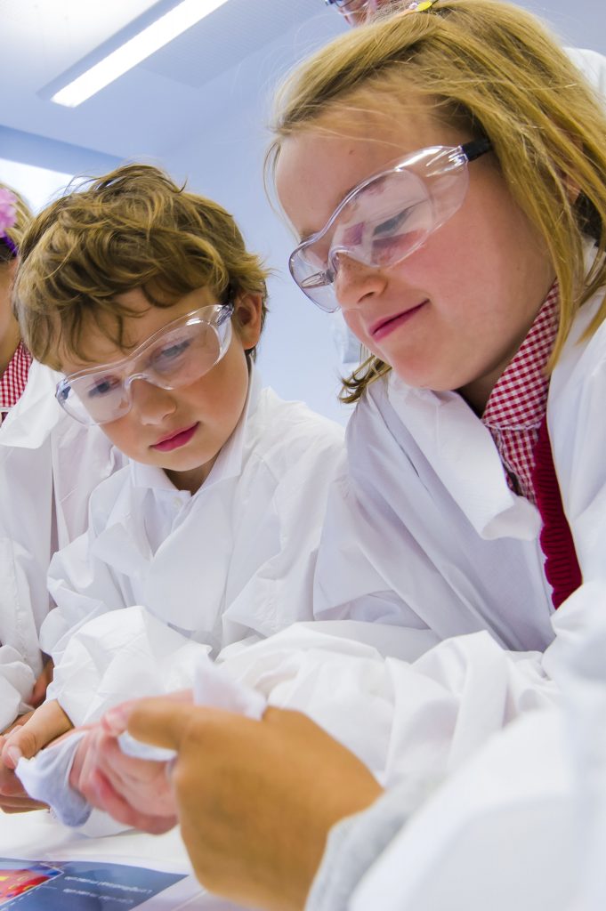 Children in lab coats at the British Science Festival 2013