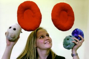 Sarah McLusky with cell and microbe toys